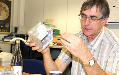 Dr William E Crofts holding CubeSat